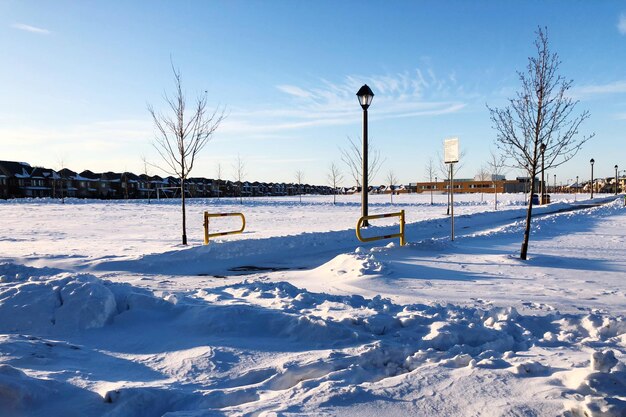 Snow covered field against sky