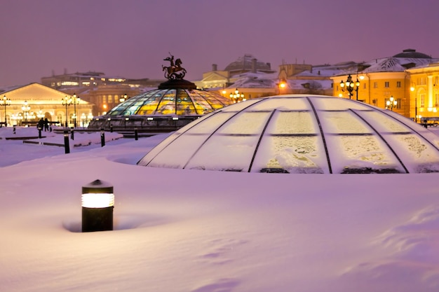 Snow covered glass cupola on Manege square Moscow