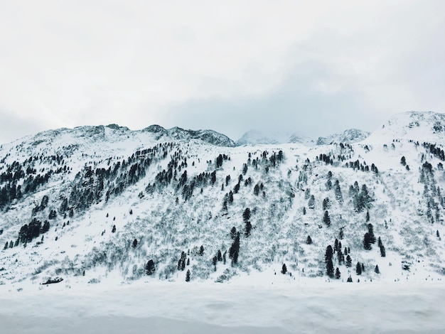 Snow covered landscape against sky