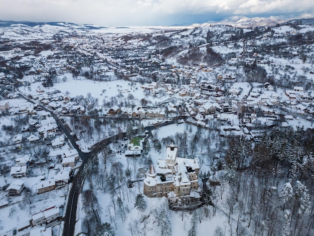 The snow covered medieval Castle of Bran known for the castle of Dracula Transylvania Romania