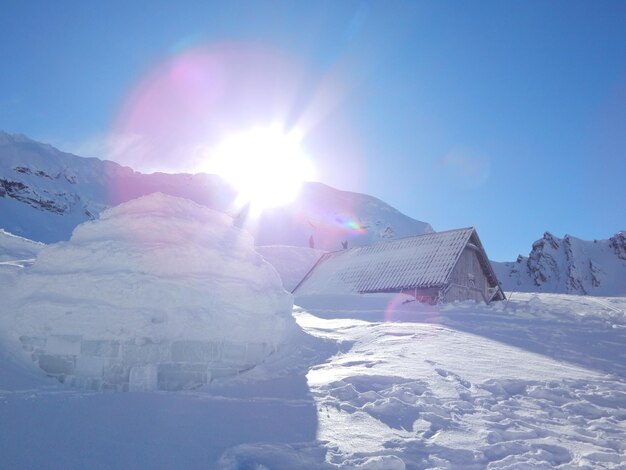 Snow covered mountain against clear sky