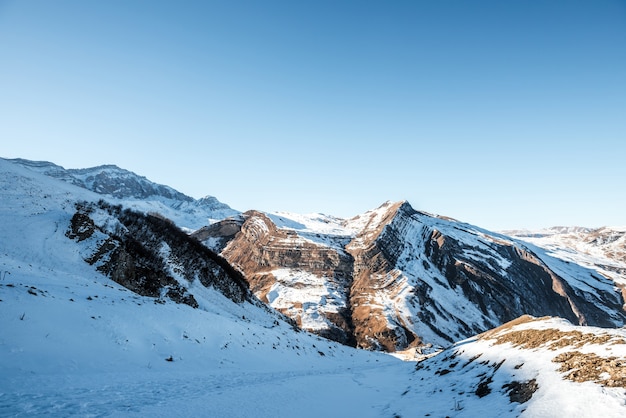 Snow covered mountains peaks, winter mountains