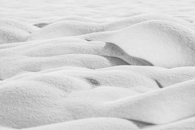 Snow drifts are isolated on a white background in shades of gray