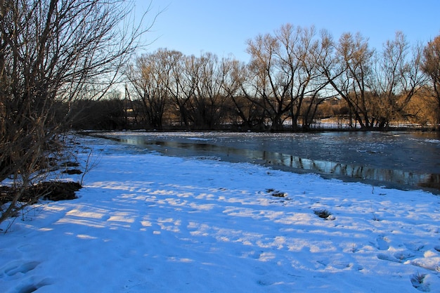 Snow melting on the meadow