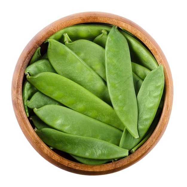 Snow peas in a bowl over white