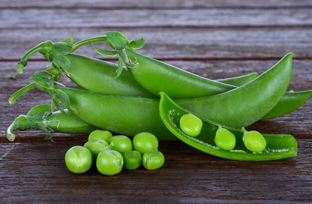 Snow peas on wooden table