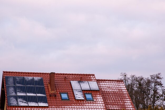 Photo snow on photovoltaic panels reduction of electricity production in winter