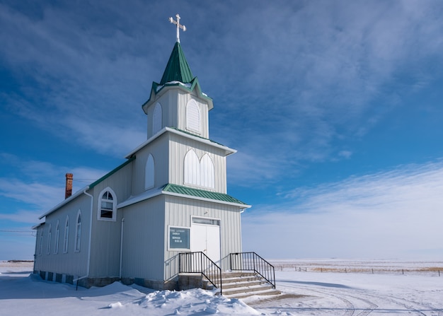Snow surrounds the historic Peace Lutheran Church on the prairies in Saskatchewan, Canada