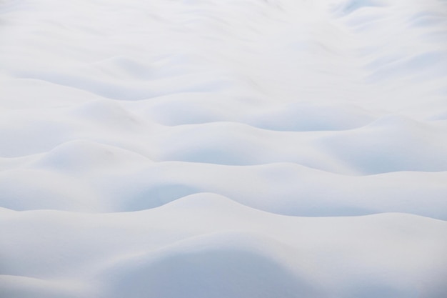 Snow texture snowcovered field with uneven surface