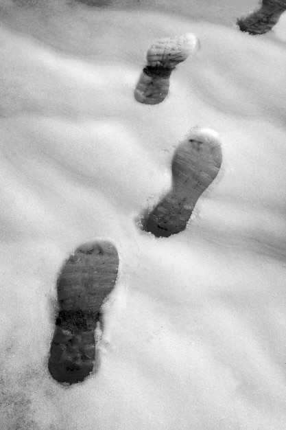 snow track shoes footprints on winter way