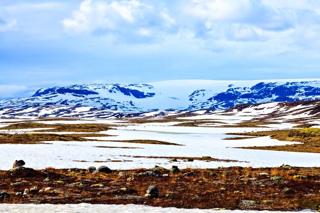 Snow valley, the mountains in the distance and sky