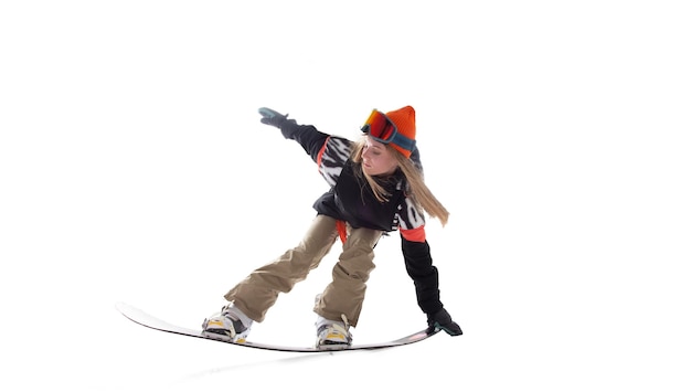 Snowboarder girl in action isolated on white