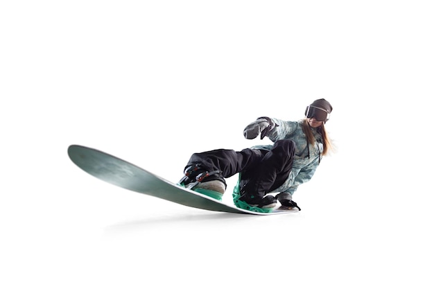 Snowboarder girl in action isolated on white