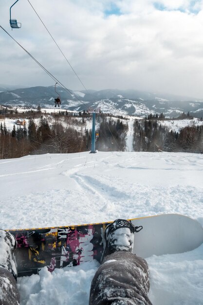 Snowboarder sitting on the ski slope