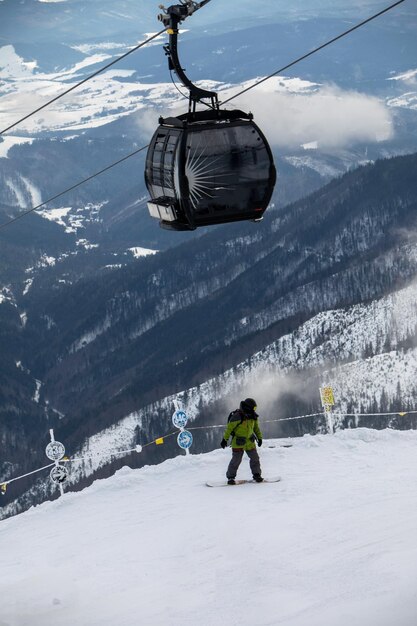 Snowboarder at the slope of chopok mountain in slovakia