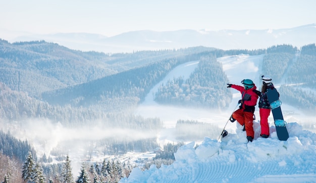 Snowboarders on top of the mountain