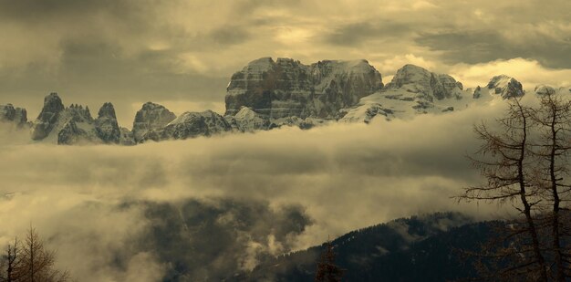Snowcapped alps mountains in clouds