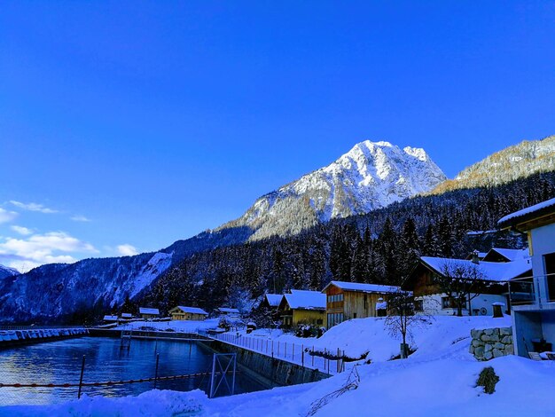 Snowcapped mountain against sky during winter