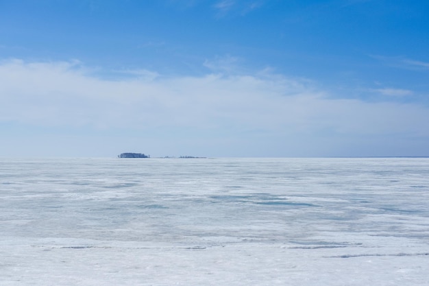 The snowcovered lake melts in the spring