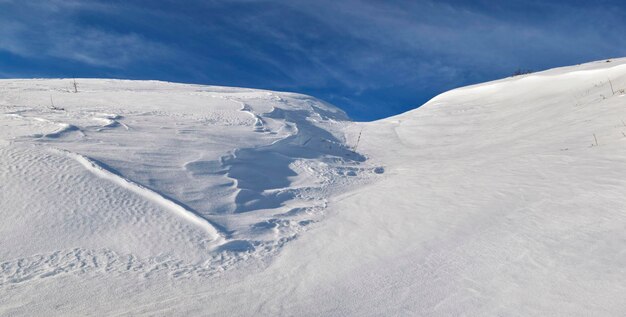 Snowcovered mountain under blue sky