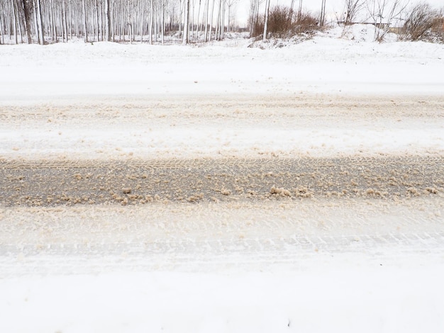 Snowdrifts on the side of the road Bad weather and traffic Snow on asphalt Difficult driving conditions Winter slosh on the road Braking distance of a car