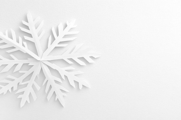 a snowflake is shown on a white wall