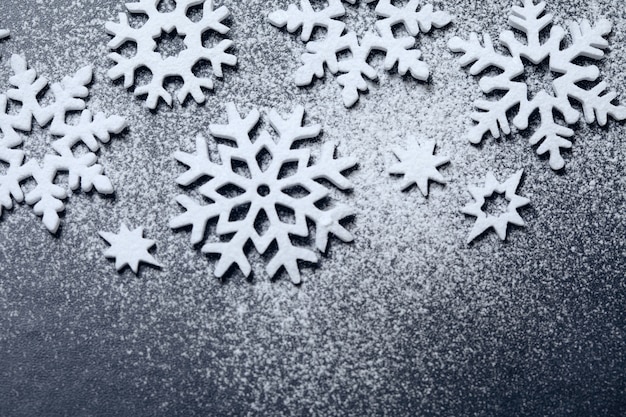 Snowflake sugar powder ornament on black chalkboard