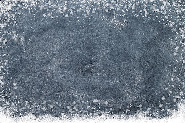 Snowflakes on a black chalkboard. Christmas concept