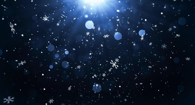 Snowflakes falling in the air against a dark background