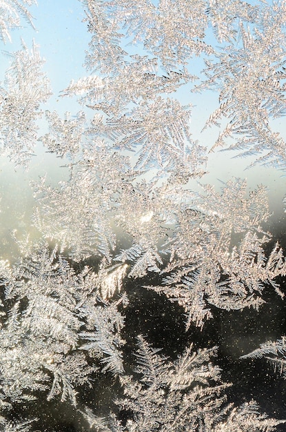 Snowflakes frost rime macro on window glass pane