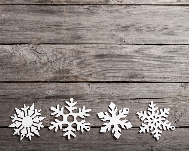 Snowflakes on grunge wooden planks