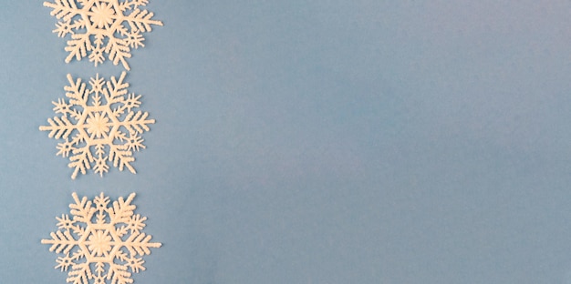 Snowflakes for New Year's decor on a blue background with space for text Christmas layout