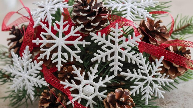 Snowflakes with pine cones and red ribbon