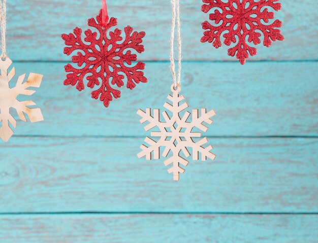 Snowflakes on wooden background