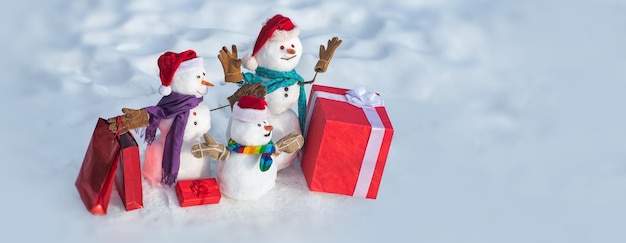 Snowman outdoor winter snowman family mother father and child wishes merry christmas and happy new y