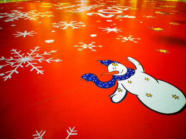 Snowman on red background with snow flake