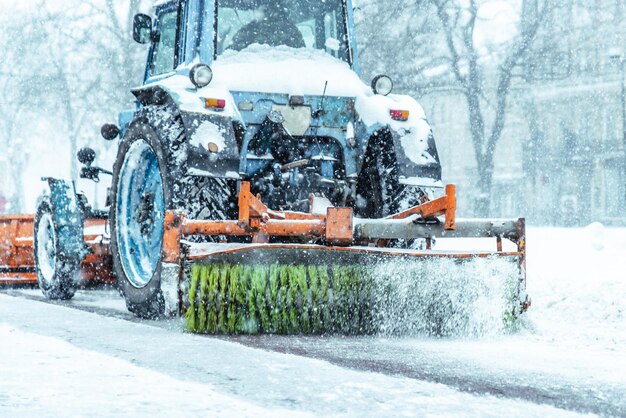 snowplow close up cleaning street of snow concept