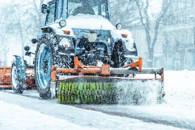 Snowplow close up cleaning street of snow concept