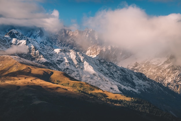 Snowy And Foggy Mountains