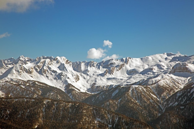 Snowy mountain peaks against the blue sky