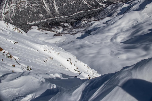 Snowy valley between the mountains of the caucasus