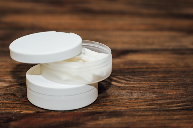 Snus box with nicotine pouches on wooden background