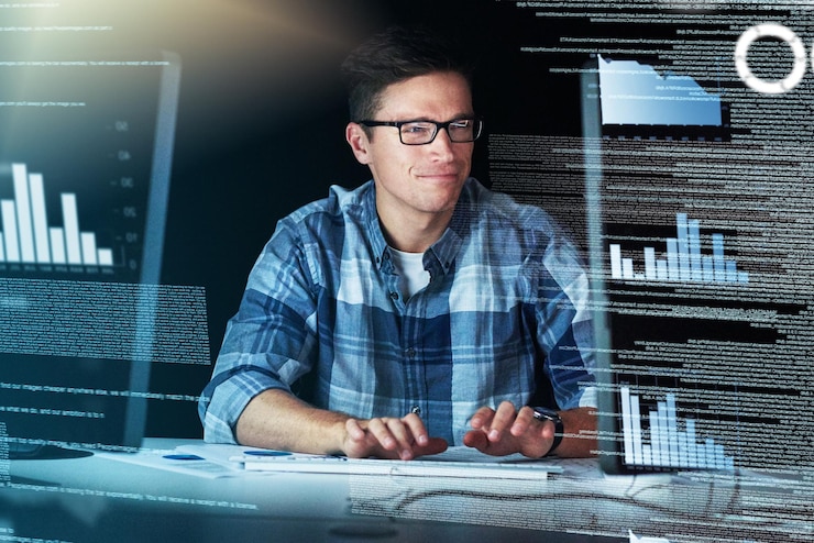 Photo so many numbers and formulas to remember cropped shot of a handsome young male programmer at work