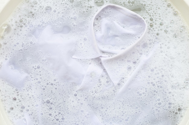 Soak cloth before washing, white shirt