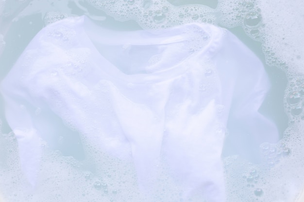 Soak cloth before washing, white t-shirt