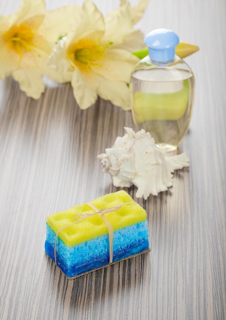 Soap bath sponge cockle shell bottle and flower