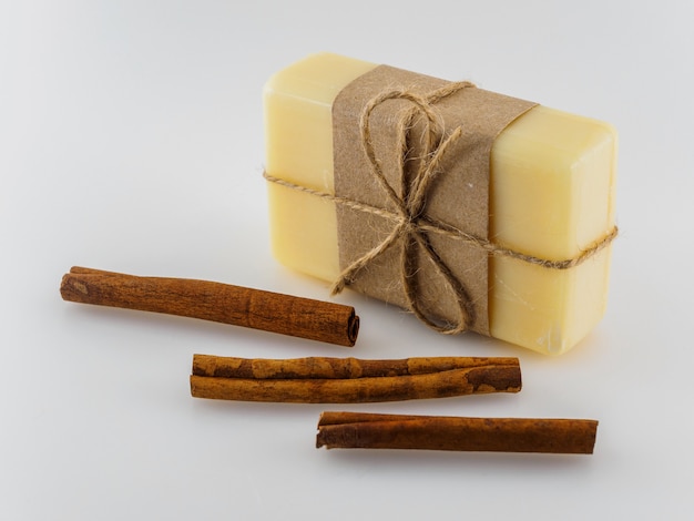 Soap in a beautiful package and cinnamon