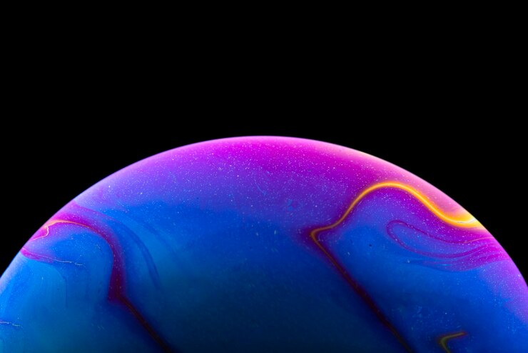 Soap bubble simulating the atmosphere of a planet with different shapes colors