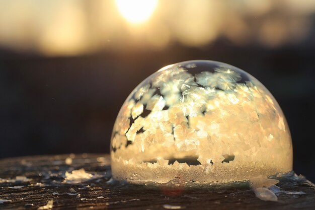 Soap bubbles freeze in the cold. Winter soapy water freezes in air.