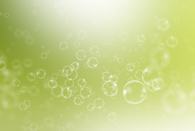 Soap bubbles on green background